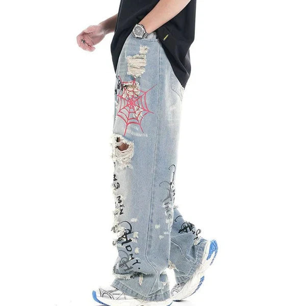 MELTEDSMILE® LIGHT BLUE RIPPED JEANS – SPIDER WEB EDITION